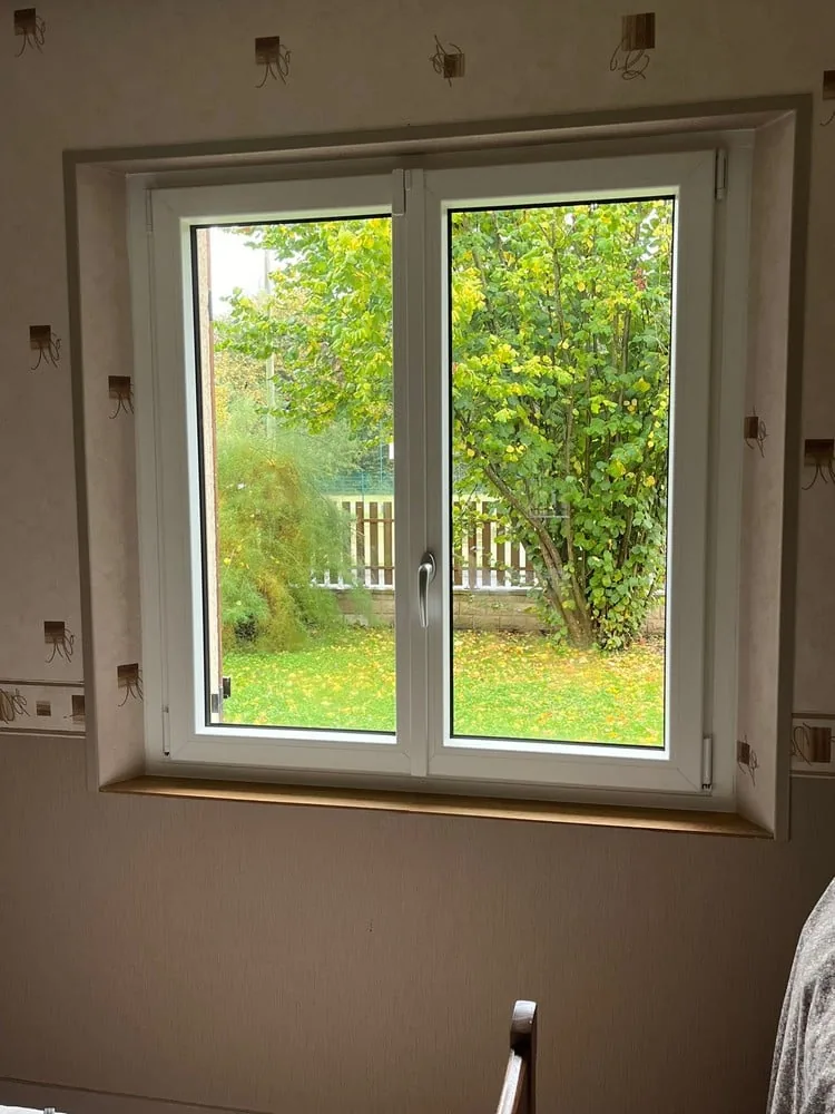 Réalisation à Seugy : Installation de fenêtres et portes-fenêtres mixtes PVC-ALU Internorm KF 310 — photo 3